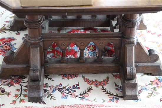 A Victorian gothic revival oak centre table, designed by Collier & Plucknett, Warwick, W.5ft D.5ft H.2ft 7in.